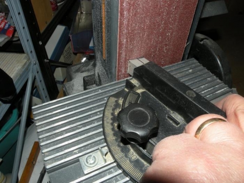 Using my belt sander to precisely grind the proper angle into the aft end of the aux longeron.