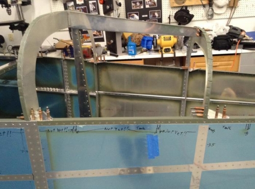 All four F-656 gusset plates drilled to the longerons.