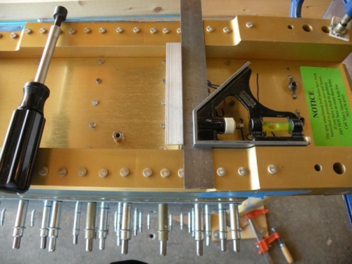 Z-bracket bolted through one hole, and squared up for match drilling the other two.