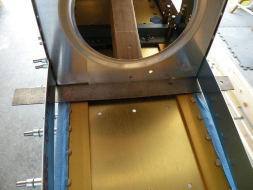 W-408-1R rib properly positioned for match drilliing the flange through the spar.