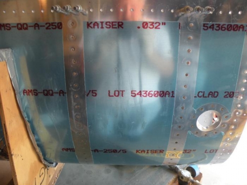 First two outboard interior ribs riveted and cleaned.