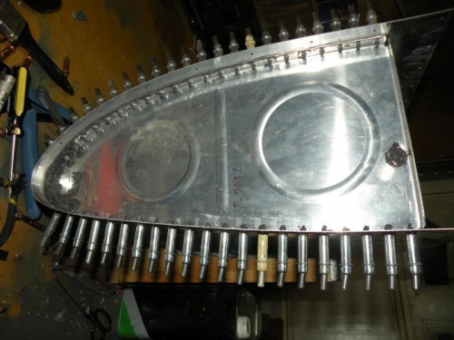 Left outboard rib sealed, clecoed, and cleaned up.