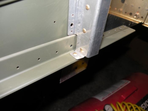 The one rivet holding the F-902R bulkhead to the right lower longeron.