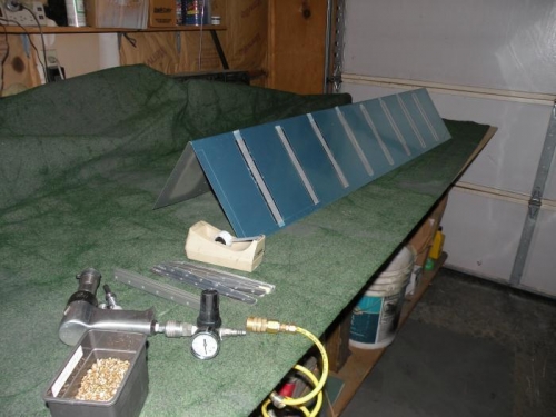 Rivets inserted and taped to the skin.