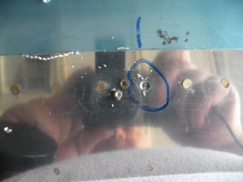 The offending rivet drilled out and cleaned the countersink with MEK.