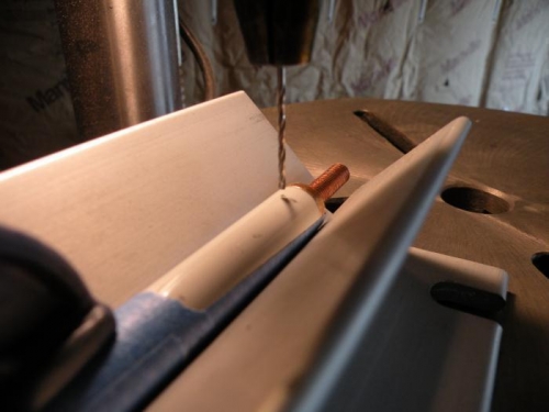 W-818 and threaded rod end jigged up for drilling.