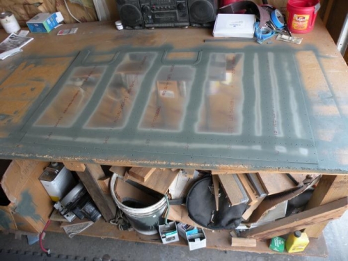 Bottom inboard skin cleaned and primed.