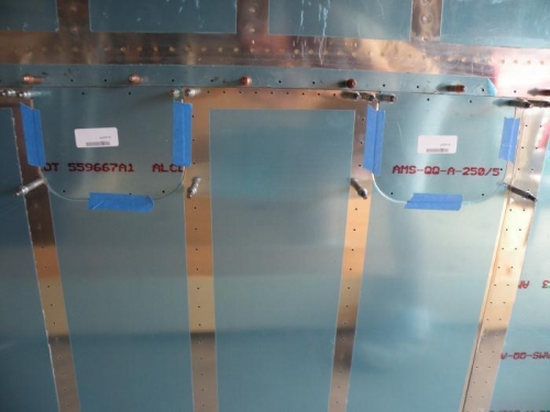 Precisely locating the access covers for match drilling to the skins.