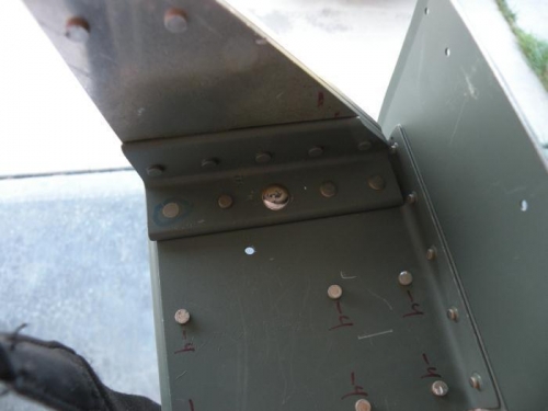 #6 rivet in left outboard aileron bracket.