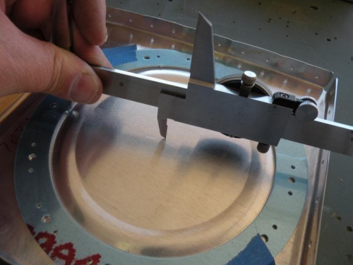 Using caliper and stiffener ring to find center of cutout.