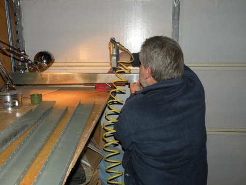 Me dimpling one of the HS forward spars with my pneumatic dimpler.