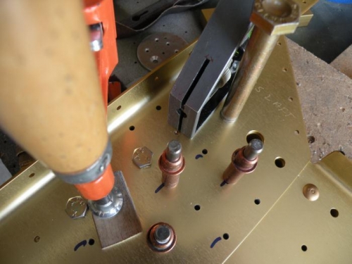 Left shear bar clamped in place, ready to drill.