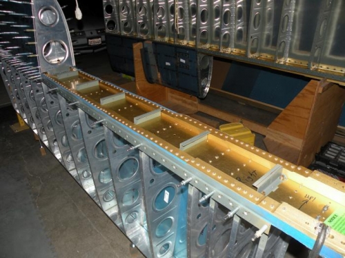 Nutplates riveted to z-brackets and spar, and brackets temp bolted in position for fitting of the tank