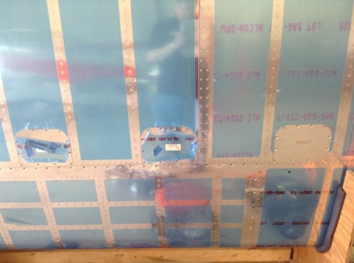 Tank and access covers temporarily attached to the right wing.