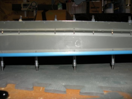 Fuzzy photo, but shows that I got the spar flange straightened.