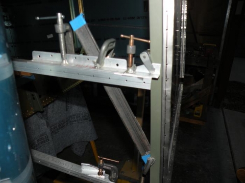 The skin stiffener braced to the firewall.