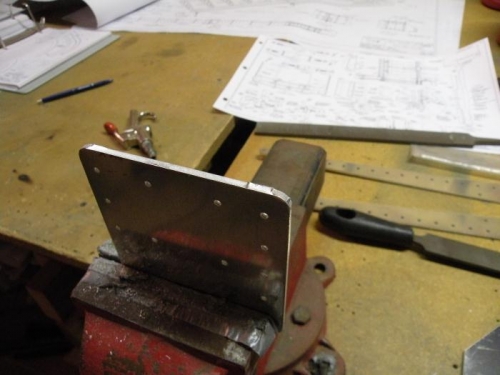 Edge of a rear spar root reinforcement plate as received.