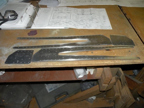 All 4 root reinforcement plates trimmed, edge deburred, and designated right and left.