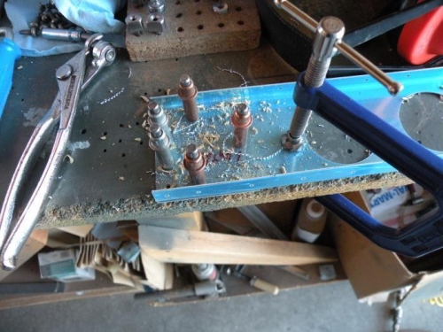 Match drilling an aileron spar reinforcement plate.