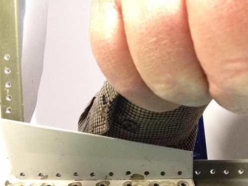 Right forward gusset rivet holes after deburring.