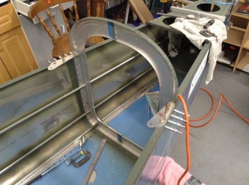 Shoulder harness anchors drilled to main longerons just forward of the F-708 bulkhead.