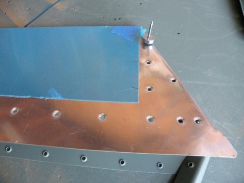 Using the pop rivet dimple dies for the horn attach holes aft of the trim tab spar.