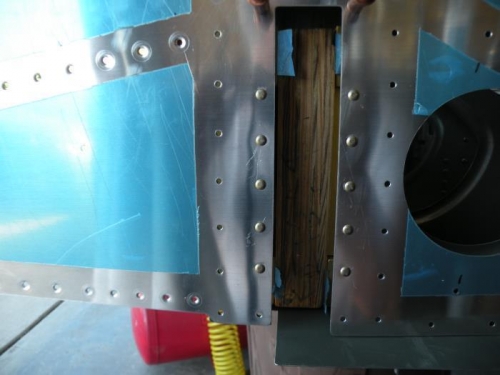 F-704H center section side plates riveted to F-770 forward side skin.