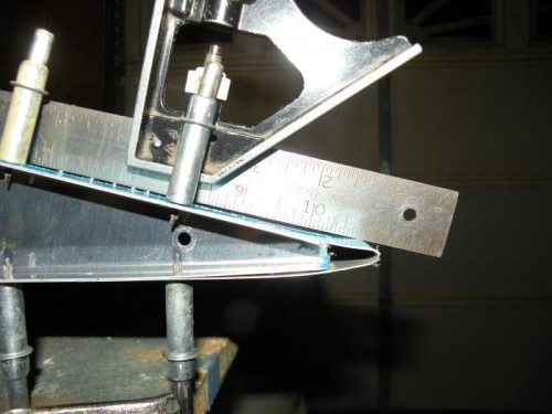 Trailing edge curled up when clecoes forced into mismatched holes.