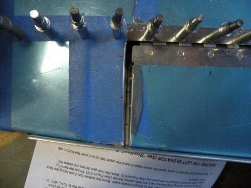 Forward hinge half match drilled to skin and trim spar. Gap is 3/32