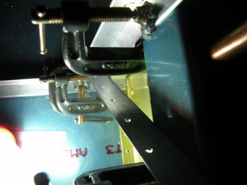 Aft end of left outboard floor stiffener is drilled.