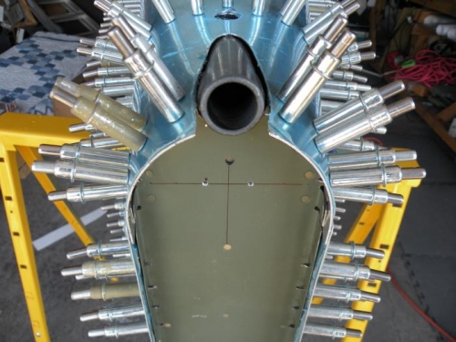 Final shape of the mount clearance hole, and keeper rivet holes drilled.