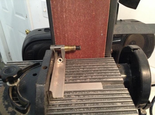 This is how I squared the ends of the bellcrank spacers and ground them to length.