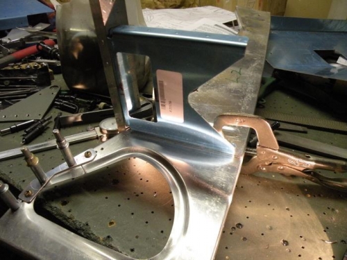 The aft bracket aligned and clamped for drilling.