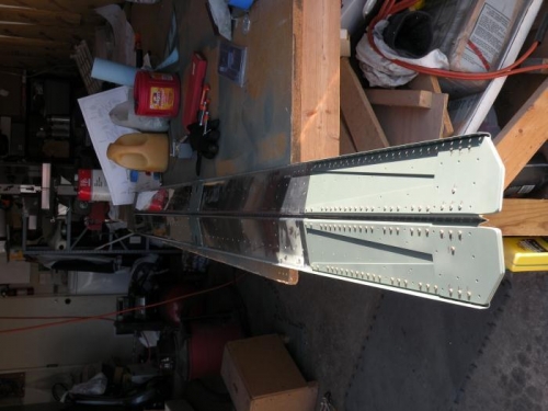 Inboard reinforcements primed and riveted.