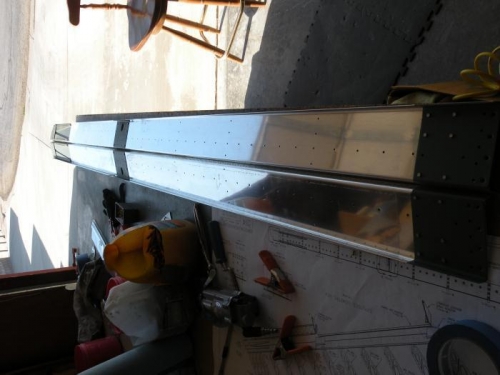 Outboard and midspan reinforcements primed and riveted.