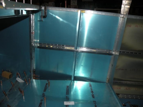 Vertical and horizontal baggage sidewall ribs clecoed in place.