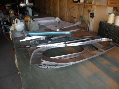 Aft fuselage bulkhead parts ready for scuffing, cleaning, and priming of faying surfaces.