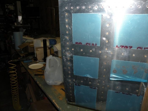 Left outboard rivets cleaned of sealant.