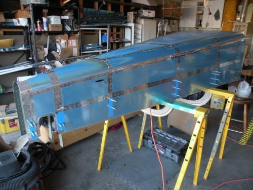 Aft fuselage skin riveting completed.