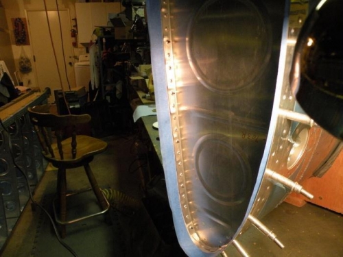 Outboard end of the right tank skin masked to keep the mating surface to the joint plate sealant-free.