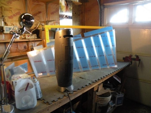 Scuffed and cleaned left rudder skin warming in front of the heater in preparation for priming.