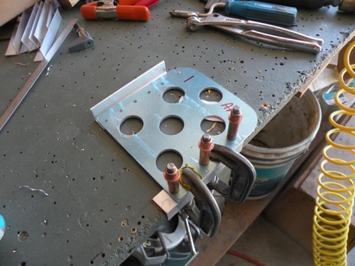 Set up to drill a support angle to the pilot's left brake pedal.