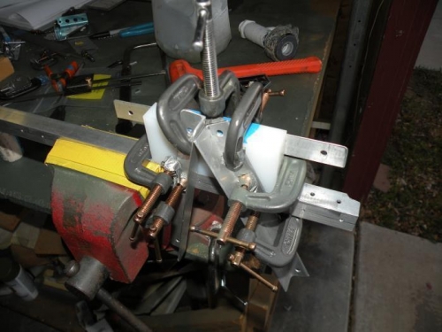 Jig to hold a bearing block in position to match drill the bolt holes through the stiffener.