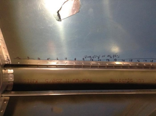 Replaced mis-set rivets in the right aft lower fuselage.