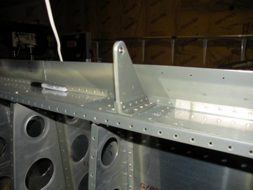 Right inboard aileron hinge bracket assembly riveted to the rear spar.