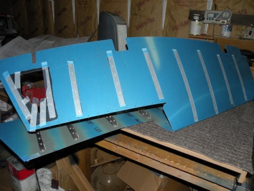 Rivets loaded on bottom of left elevator skin.