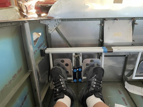 Trying the rudder and brake pedals on for size.