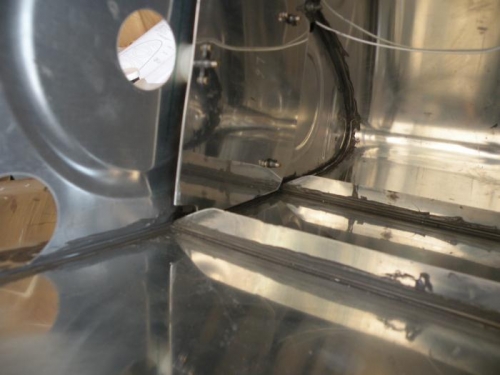 Left outboard capacitance plate trimmed to clear stiffeners and final installed.