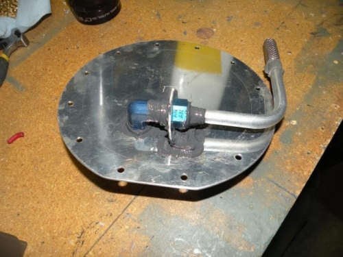 Pickup tube, fitting, and retainer bracket final installed and sealed.