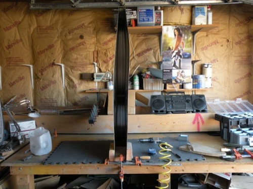 Skin standing vertically for riveting the HS-707 center nose rib.